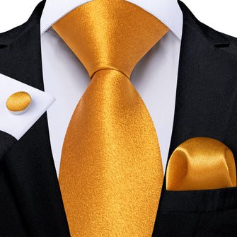 black suit with orange tie