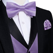 purple vest and bow tie