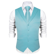 light blue vest and tie