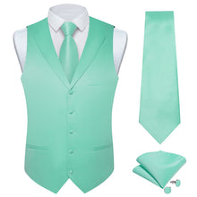 sage green vest and tie